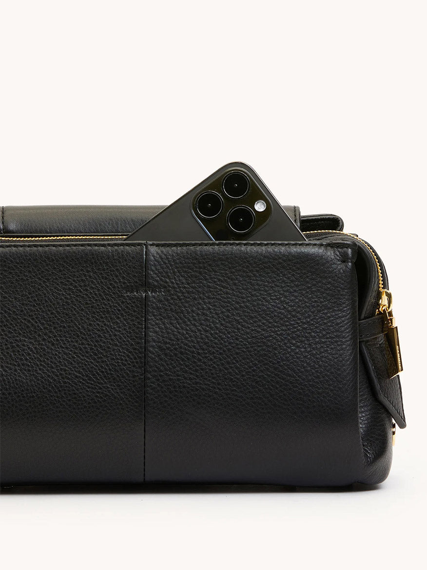 The Hammitt Los Angeles Charlotte Medium in Black/Brushed Gold is a stylish, large-capacity pebble leather bag with a zippered pocket—perfect for carrying essentials like a triple-lens smartphone.