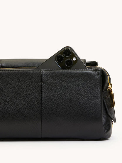 The Hammitt Los Angeles Charlotte Medium in Black/Brushed Gold is a stylish, large-capacity pebble leather bag with a zippered pocket—perfect for carrying essentials like a triple-lens smartphone.