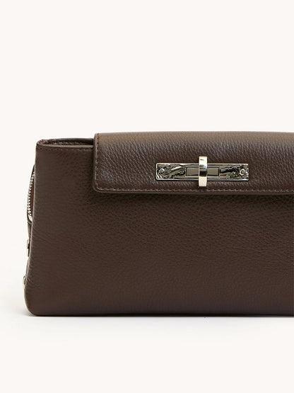 A close-up of the Hammitt Los Angeles Charlotte Small evening clutch in Espresso Pebble leather with a silver clasp, set against a plain light background.