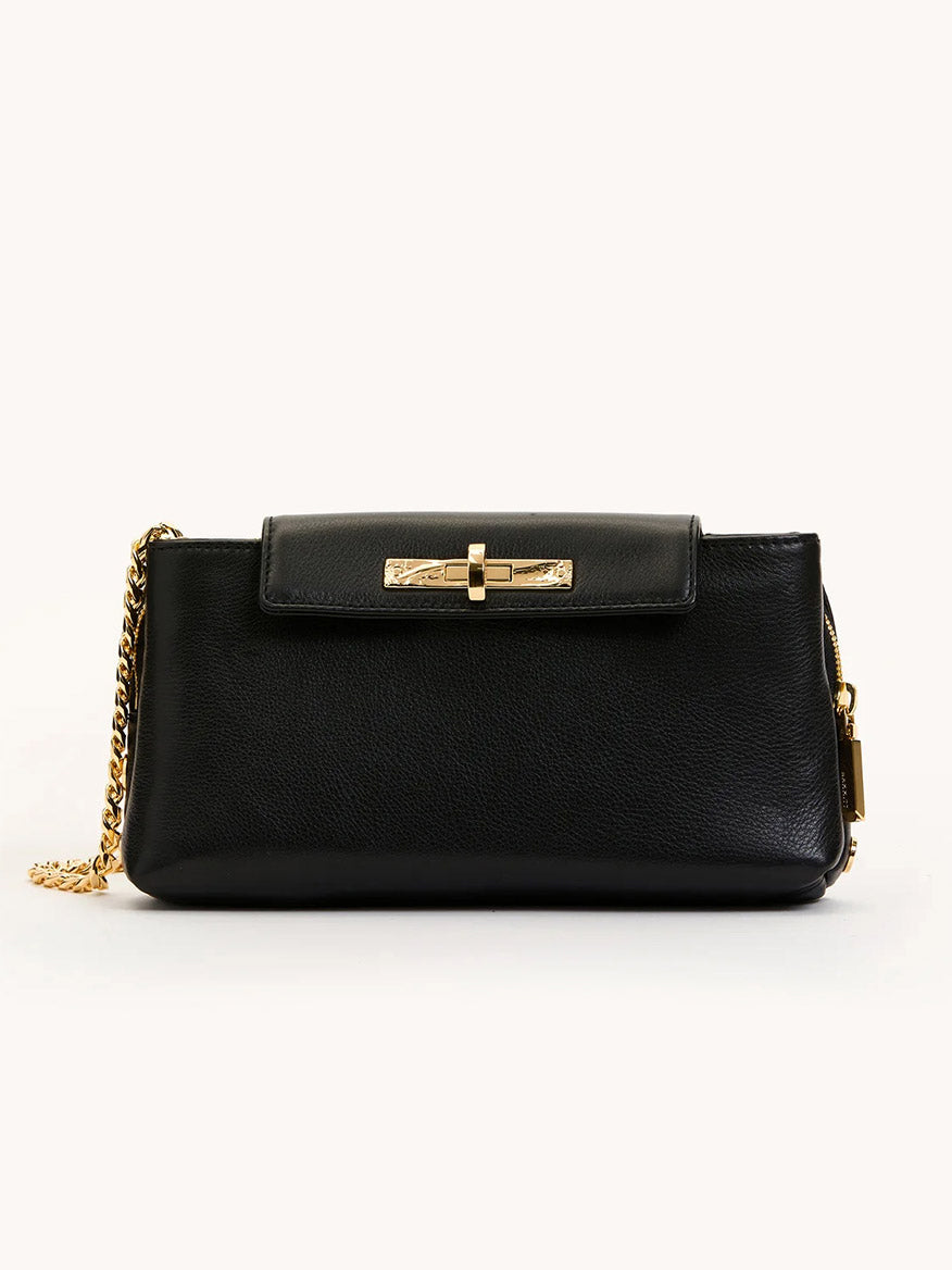 Hammitt Los Angeles Charlotte Small crossbody in black pebble leather features a gold chain strap and front flap with gold clasp, shown against a plain light background.