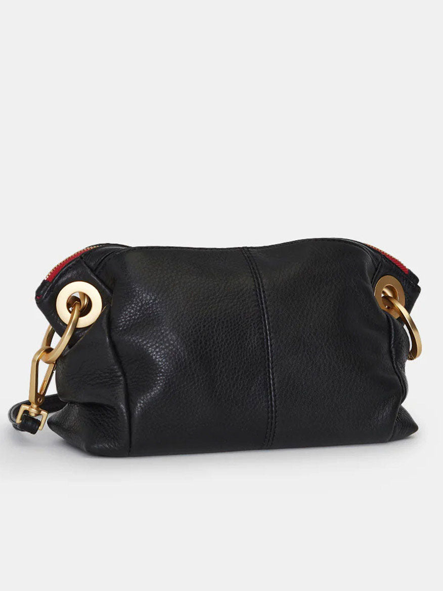 The Hammitt Los Angeles Daniel Crossbody Clutch Small showcases sleek black pebbled leather, accented with brushed gold rings and a striking red strap detail.