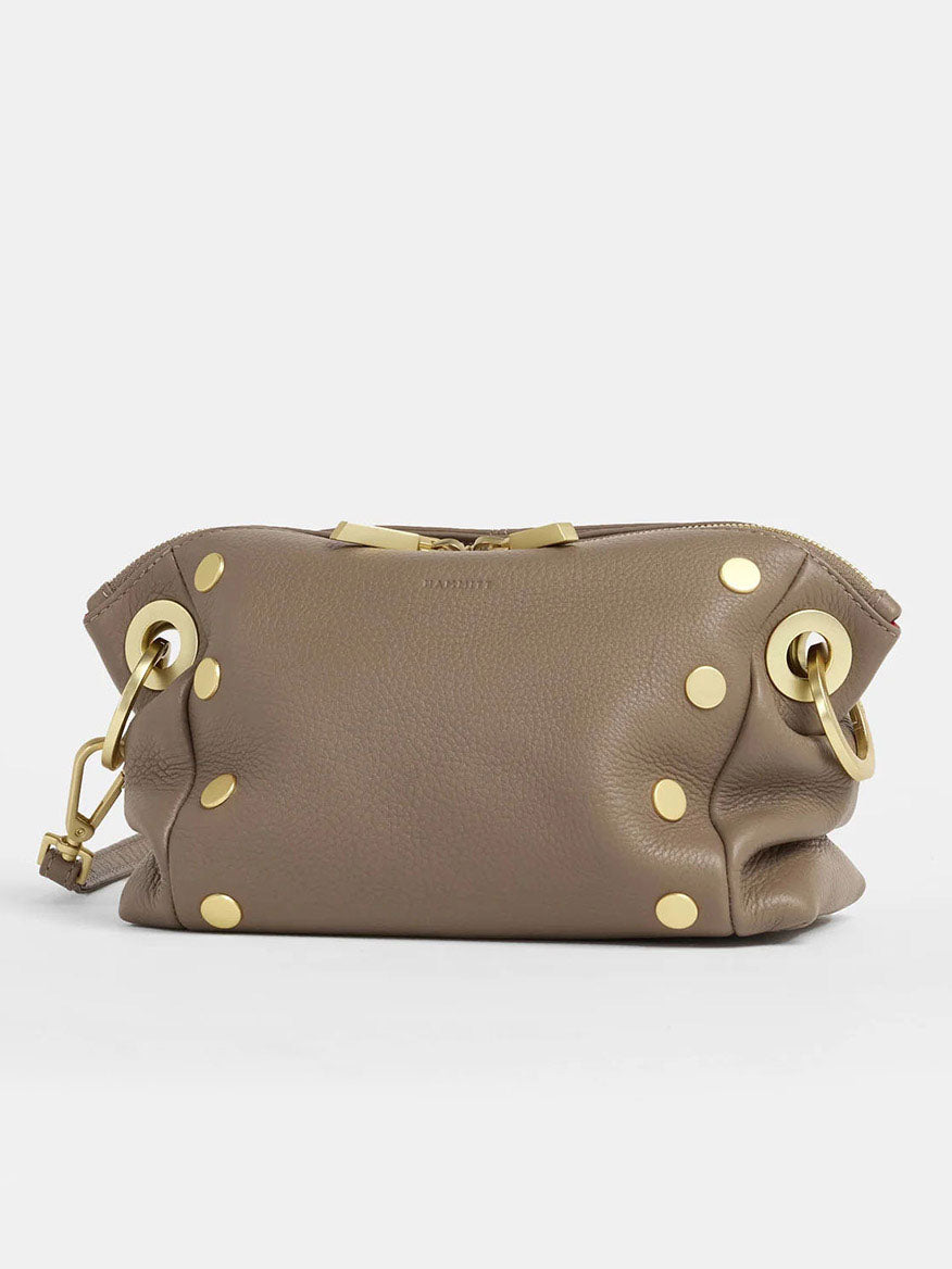 The Hammitt Los Angeles Daniel Crossbody Clutch Small in Sculpted Taupe features pebbled taupe leather with gold studs and hardware.