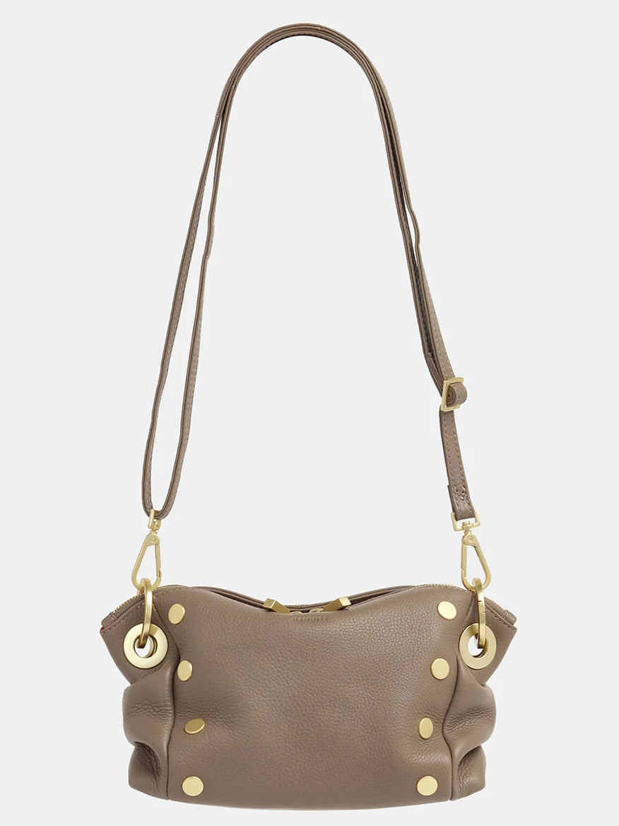 This Hammitt Los Angeles Daniel Crossbody Clutch Small from the Sculpted Taupe collection showcases a taupe pebbled leather exterior, complemented by a long strap and gold-tone stud details.