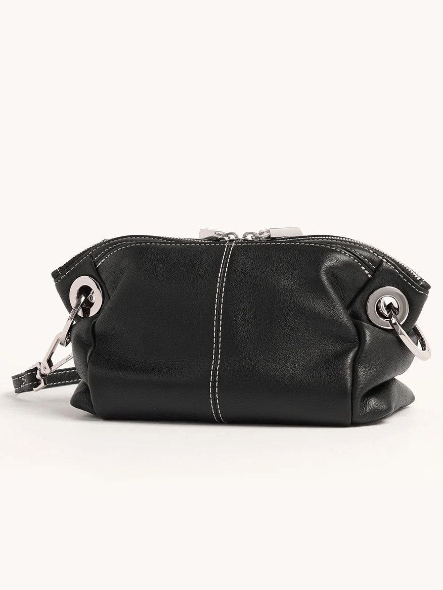 The Hammitt Los Angeles Daniel Crossbody Clutch Small in Tempo Black features pebbled leather, silver metal rings, a zipper closure, and a detachable crossbody strap for versatile styling.