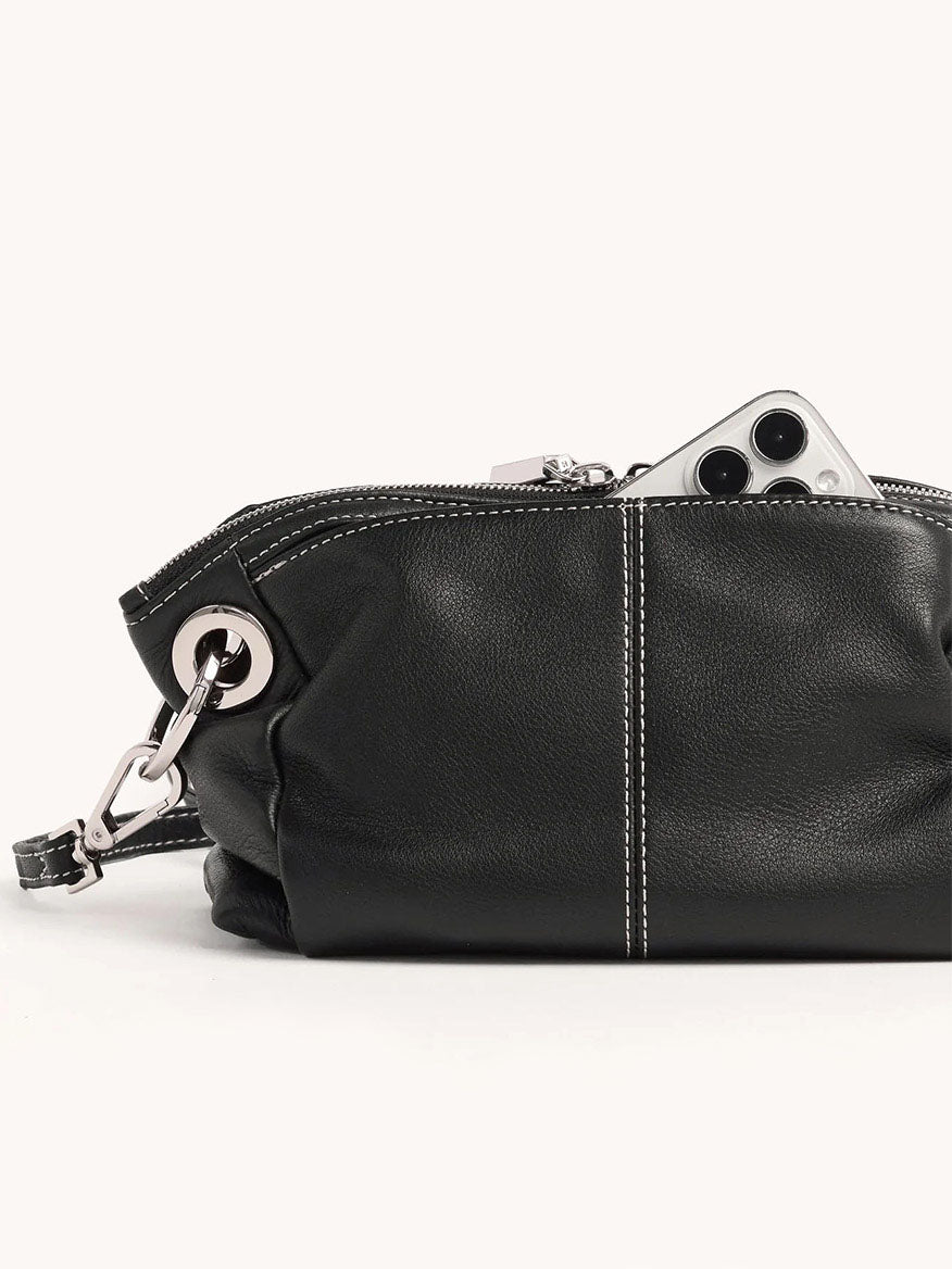 The Hammitt Los Angeles Daniel Crossbody Clutch Small in Tempo Black features black pebbled leather, a silver zipper showing a smartphone inside, metal hardware, white stitching, and an adjustable crossbody strap for convenience.