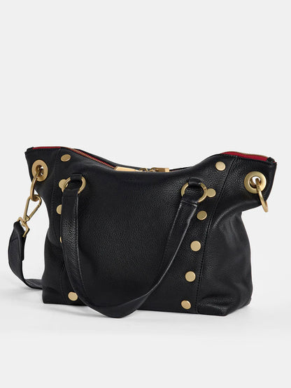 The Hammitt Los Angeles Daniel Medium Satchel in black with brushed gold trim and a red zipper features gold studs and hardware, two handles, and an adjustable crossbody strap for versatile wear.