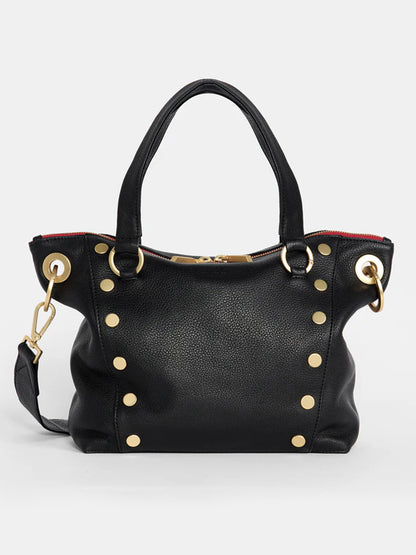 The Hammitt Los Angeles Daniel Medium Satchel in black, featuring brushed gold studs, two handles, and a detachable, adjustable crossbody strap with a top zipper lined in red.