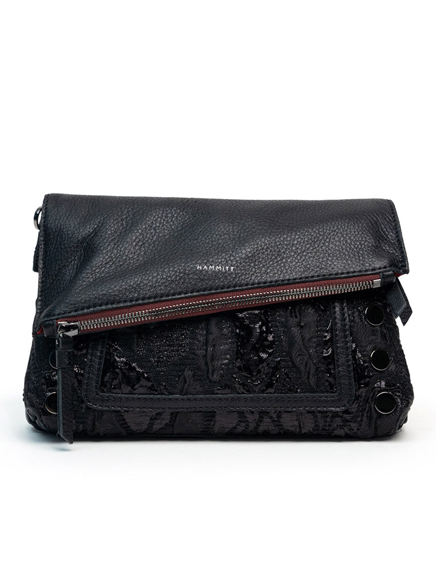 The Hammitt Los Angeles Dillon Small in Midnight Marquise/Gunmetal is a black leather convertible clutch with a textured flap, gunmetal grommets on the side, and a front zippered pocket.