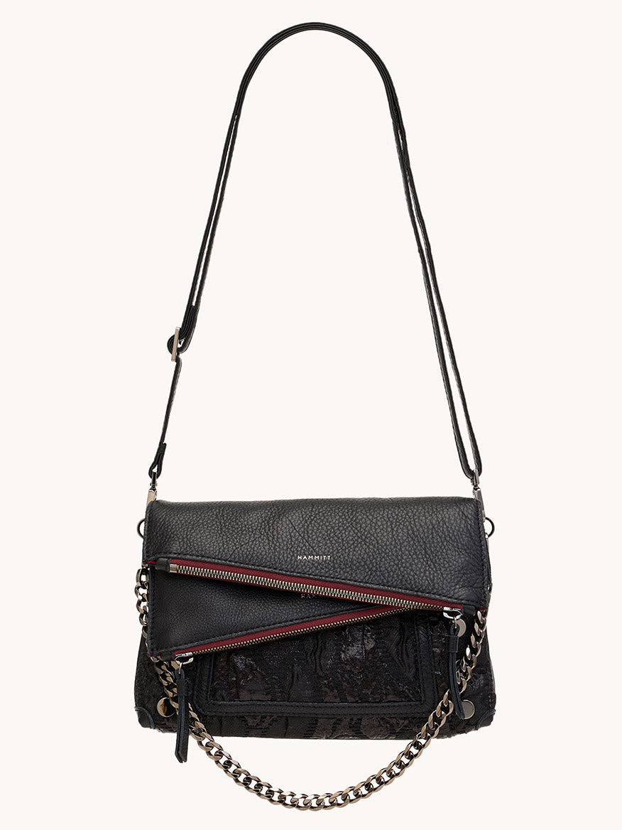 The Hammitt Los Angeles Dillon Small in Midnight Marquise/Gunmetal is a black Italian leather purse with a textured finish, two diagonal front zippers with red accents, chain detail, and an adjustable shoulder strap.