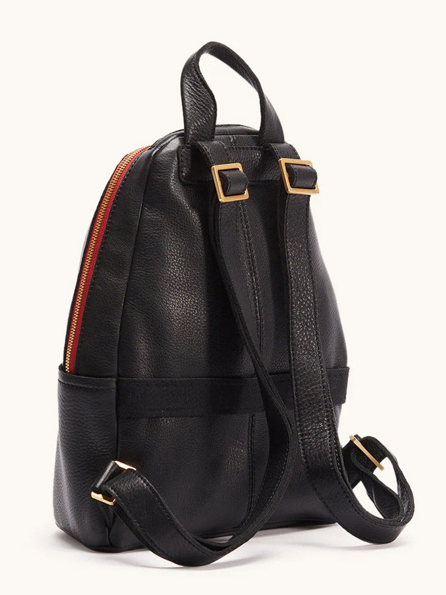 The Hammitt Los Angeles Hunter Medium Backpack in Black/Brushed Gold/Red Zip features a compact leather design with adjustable straps, gold-tone buckles, and a red zipper—ideal as a stylish day backpack for your essentials.