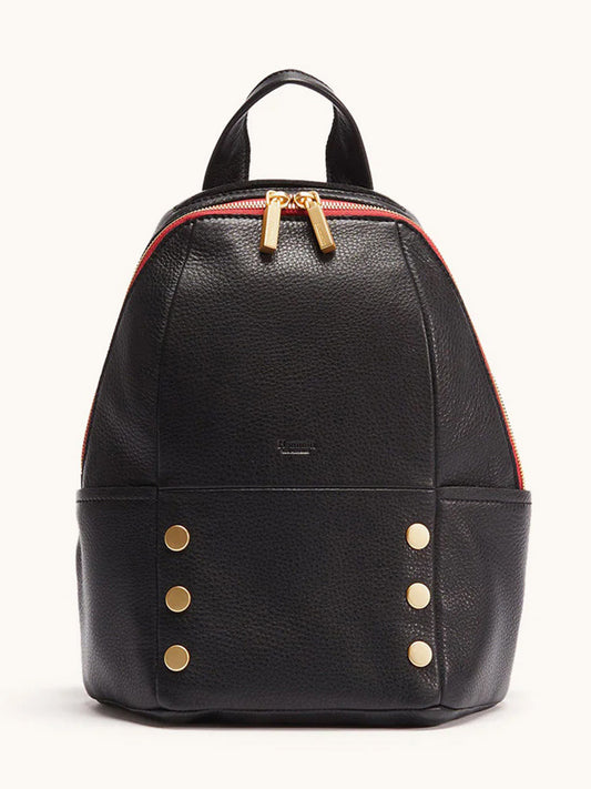 The Hammitt Los Angeles Hunter Medium Backpack in Black/Brushed Gold/Red Zip features black leather, a red zipper, gold hardware, and four gold studs on each lower front side—a stylish travel accessory shown against a plain light background.