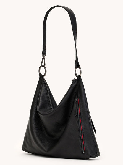 The Hammitt Los Angeles Kyle Large Shoulder Bag in Black/Gunmetal features black pebble leather, a single strap, gunmetal hardware, and a front zipper pocket with a red accent—perfect for everyday style and convenience.