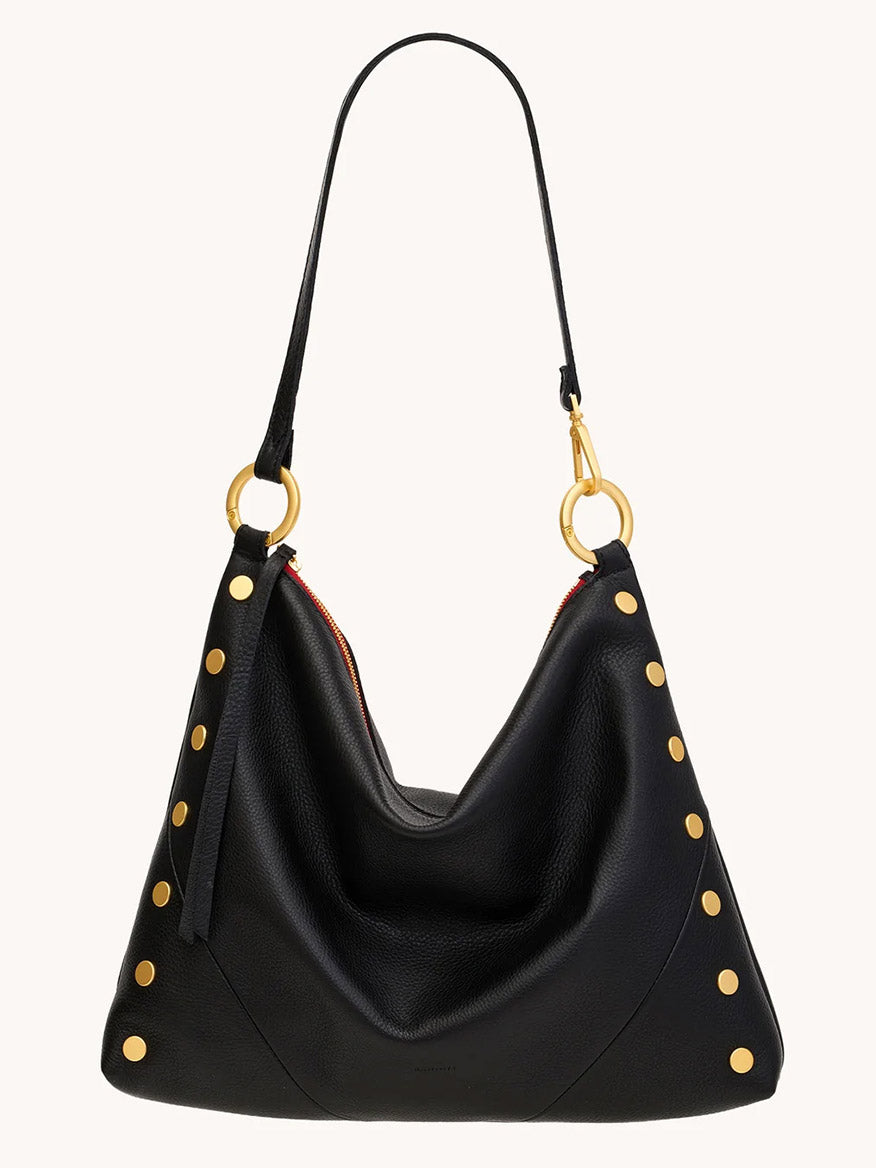The Hammitt Los Angeles Kyle Large Shoulder Bag in Black/Brushed Gold & Red Zip features black pebble leather, gold studs, ring hardware, and a roomy design—perfect as an everyday crossbody with standout style.