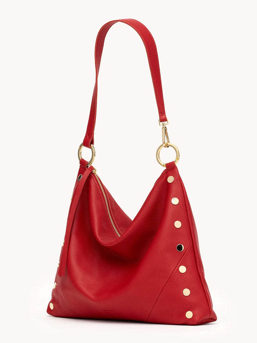 The Hammitt Los Angeles Kyle Large Shoulder Bag in Chili Red/Gold features pebble leather, gold hardware, a single shoulder strap, and round metal studs along the sides.