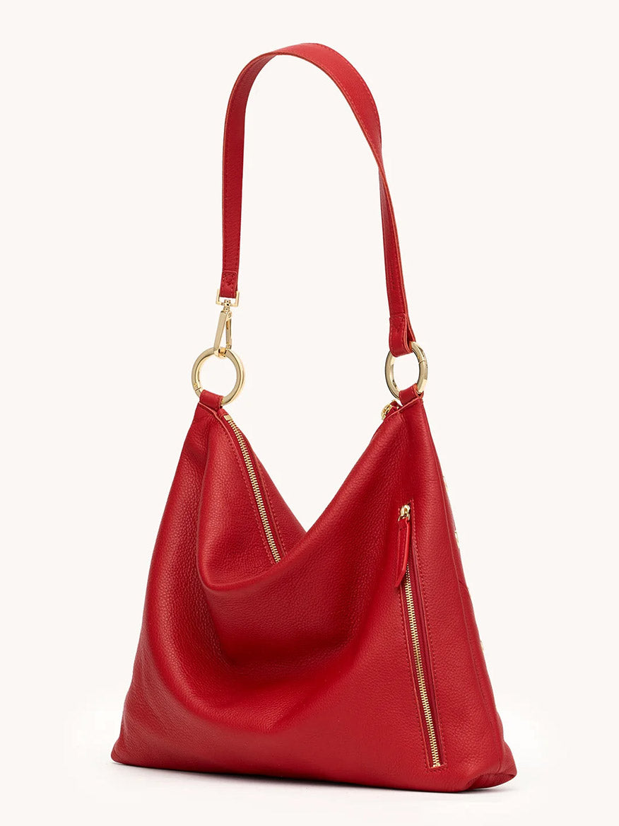 The Hammitt Los Angeles Kyle Large Shoulder Bag in Chili Red/Gold features pebble leather, gold hardware, two diagonal zipper pockets, and an adjustable strap—an iconic designer shoulder bag.
