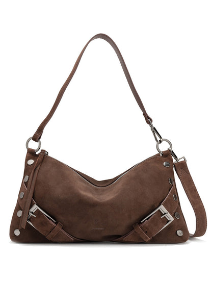 The Hammitt Los Angeles Kyle Medium Shoulder Bag in belted brown suede features gunmetal hardware, decorative buckles, and a detachable strap, shown against a white background.