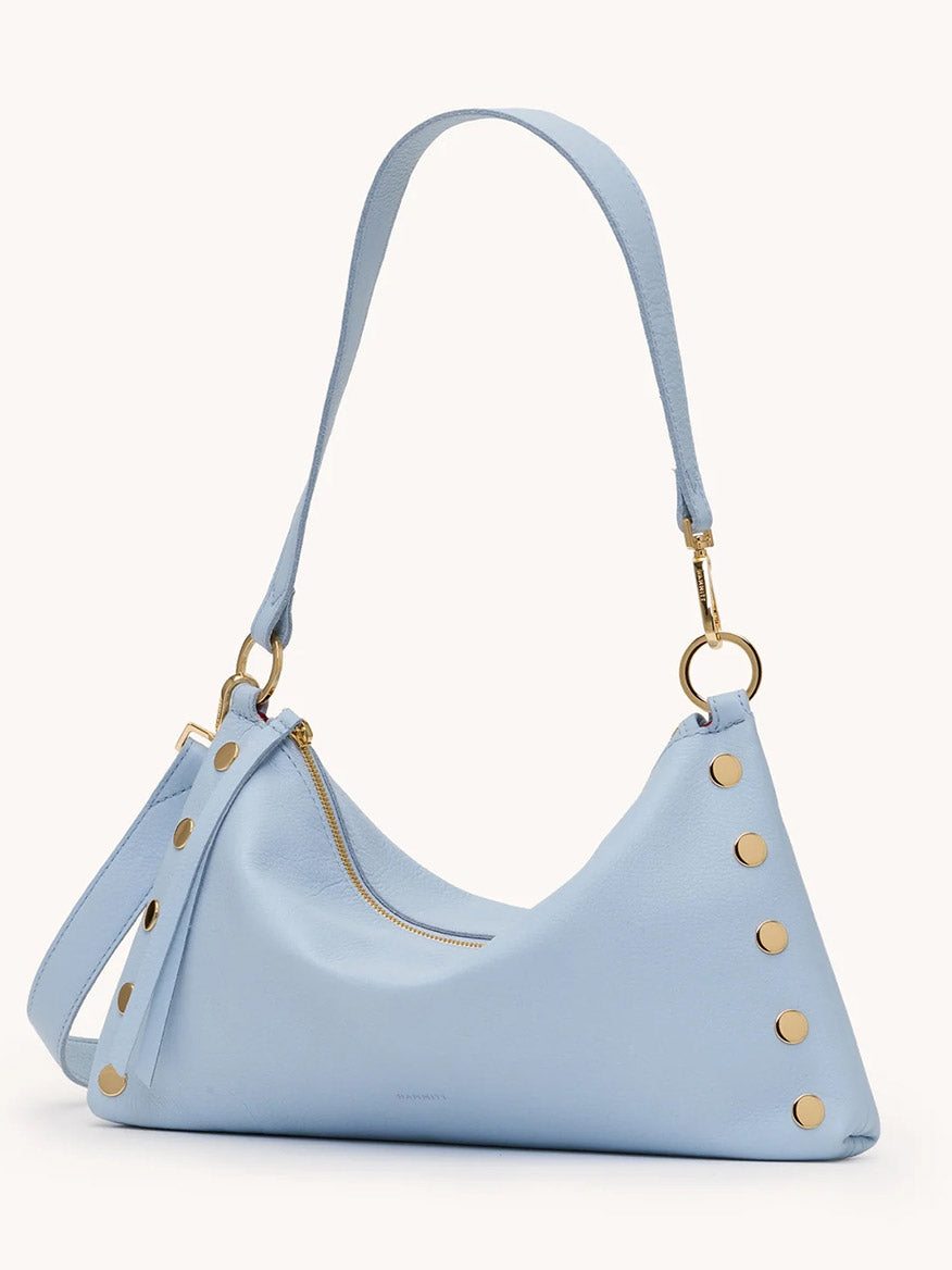 The Hammitt Los Angeles Kyle Medium Shoulder Bag in Hazy Blue/Gold features pebbled leather, gold studs and hardware, a zip closure, plus a matching adjustable strap—perfect for stylish crossbody or shoulder wear.