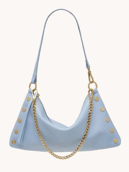 The Hammitt Los Angeles Kyle Medium Shoulder Bag in Hazy Blue/Gold features pebbled leather, gold studs, a detachable gold chain, and an adjustable shoulder strap, displayed against a plain background.