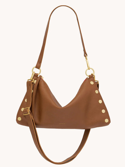 The Hammitt Los Angeles Kyle Medium Shoulder Bag in Mahogany Pebble with brushed gold hardware and red zip features decorative gold studs on the side and an adjustable shoulder strap.