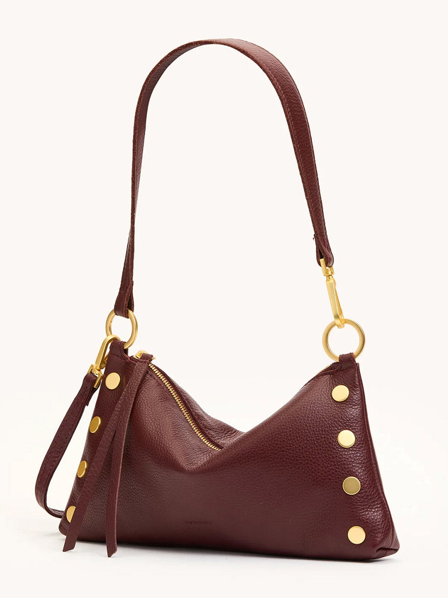 The Hammitt Los Angeles Kyle Shoulder Bag in Cherrywood Pebble features brushed gold hardware, including ring attachments and round studs, a zipper closure, and a matching leather strap.