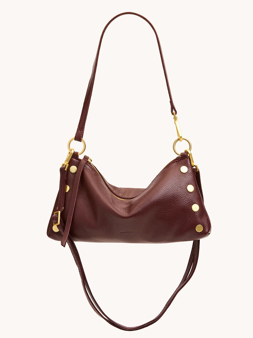 The Hammitt Los Angeles Kyle Shoulder Bag in Cherrywood Pebble leather features brushed gold hardware, two shoulder straps, and gold studs, shown against a plain background.