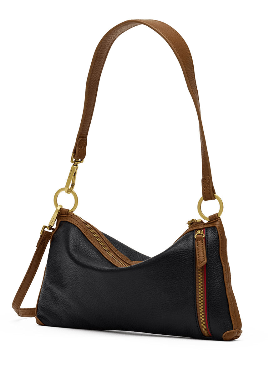 Introducing the Hammitt Los Angeles Kyle Shoulder Bag in East End/Antique Gold—crafted from black pebbled leather with a brown shoulder strap, gold hardware, and a signature diagonal red zipper. This crossbody bag boasts a soft, slouchy silhouette and includes a detachable crossbody strap for versatile styling options.