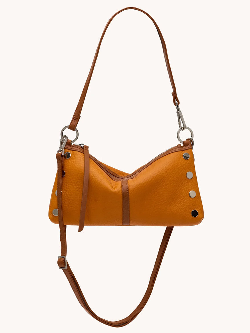 The Hammitt Los Angeles Kyle Shoulder Bag in Tailored Tangerine/Silver features orange leather, silver studs, two brown adjustable straps, and a zipper closure, shown against a plain background.