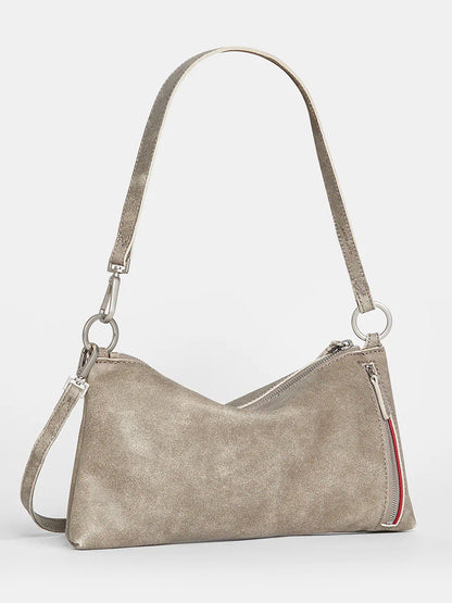 A Hammitt Los Angeles Kyle Shoulder Bag in Pewter in beige with an adjustable crossbody strap, featuring a diagonal zippered compartment above a small red zippered pocket.