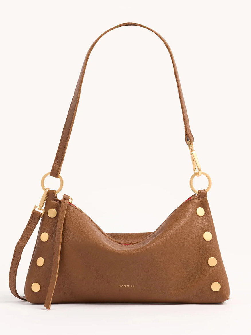 The Hammitt Los Angeles Kyle Shoulder Bag in Mahogany Pebble & Red Zip features gold-tone hardware, side rivets, and a shoulder strap, displayed against a plain light background.