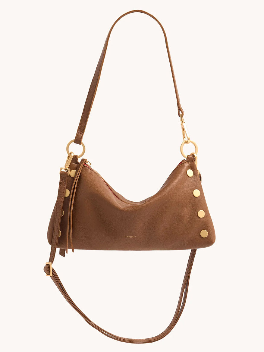 The Hammitt Los Angeles Kyle Shoulder Bag in Mahogany Pebble & Red Zip features medium brown pebbled leather, gold hardware, decorative gold studs on one side, a zipper closure, and adjustable straps.