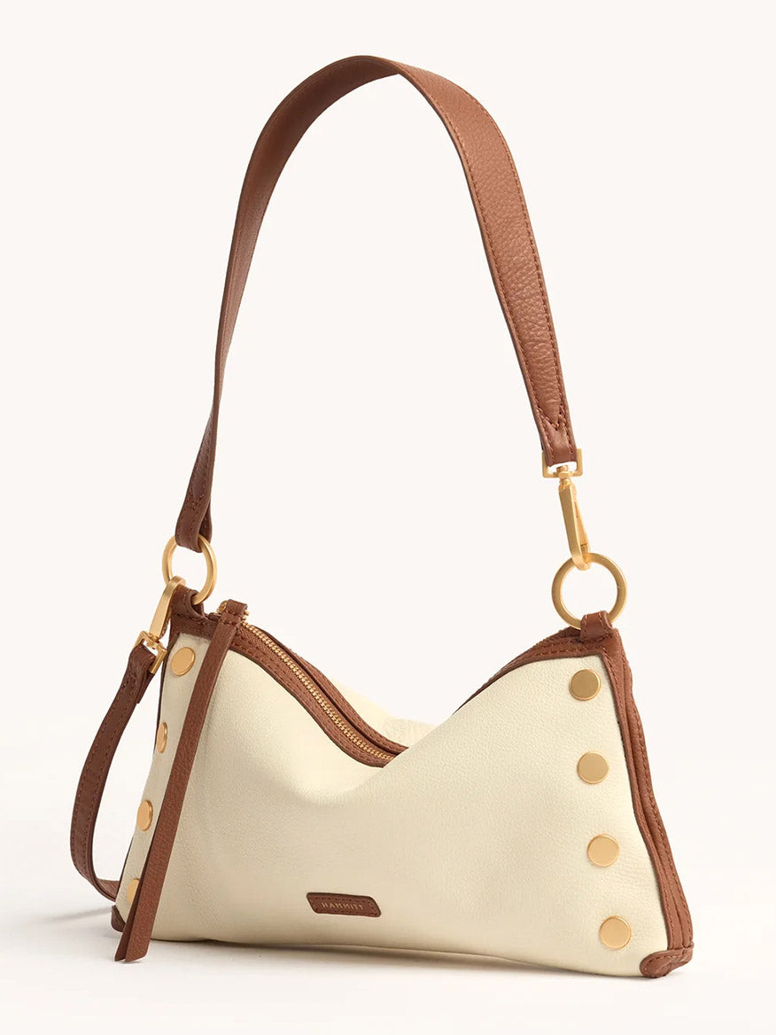 The Hammitt Los Angeles Kyle Shoulder Bag in Courtyard Cream features pebbled leather in cream and brown, gold hardware, zip closure, decorative gold studs, and an adjustable crossbody strap.
