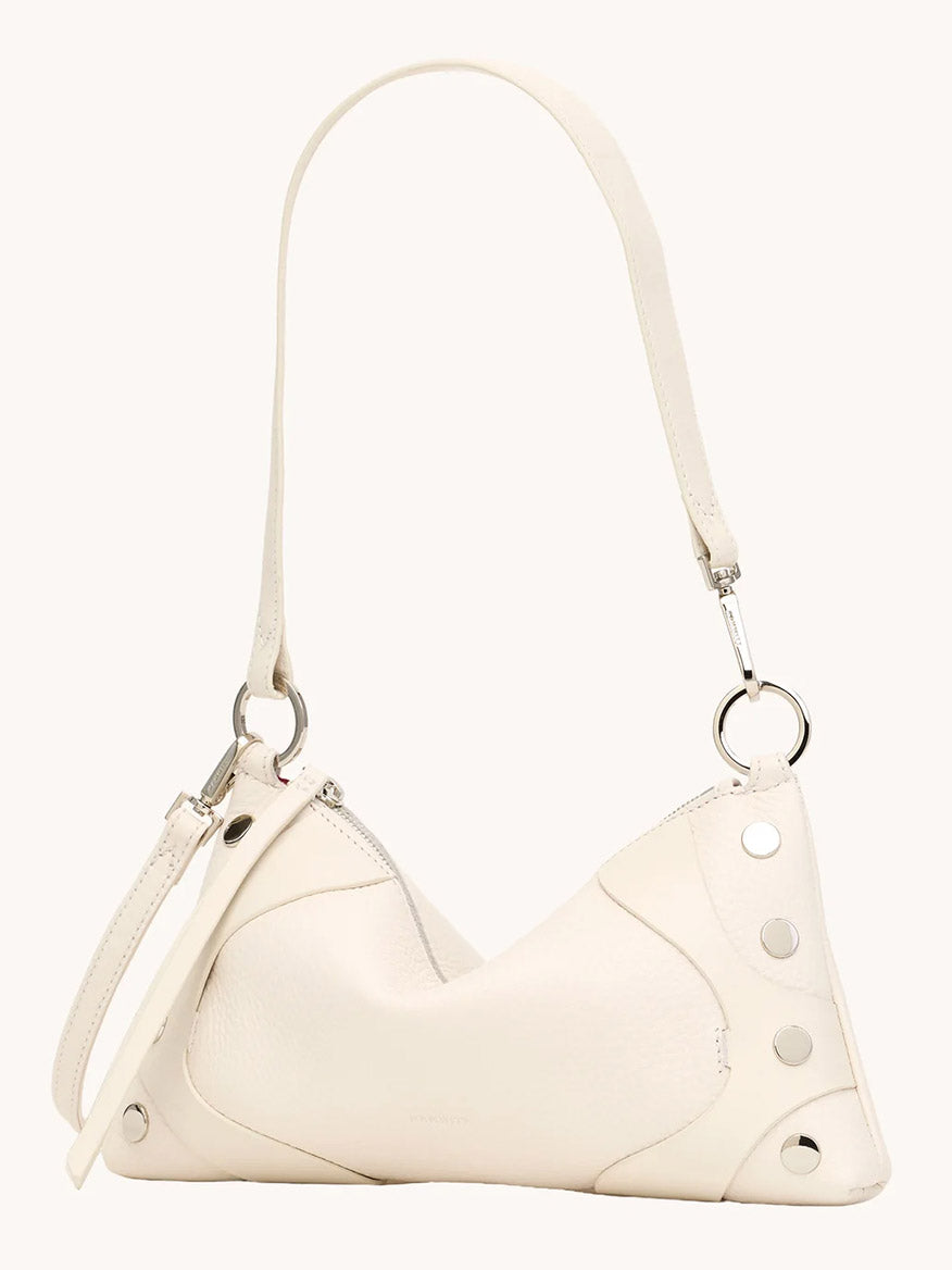 The Hammitt Los Angeles Kyle Shoulder Bag in Western Rein/Silver features minimalist white pebble leather, a single handle, silver hardware, and metal corner studs, displayed against a plain background.