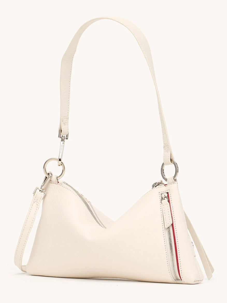 The Hammitt Los Angeles Kyle Shoulder Bag in Western Rein/Silver features white pebble leather, a single shoulder strap, two silver zippers, and a minimalist design, shown against a plain background.