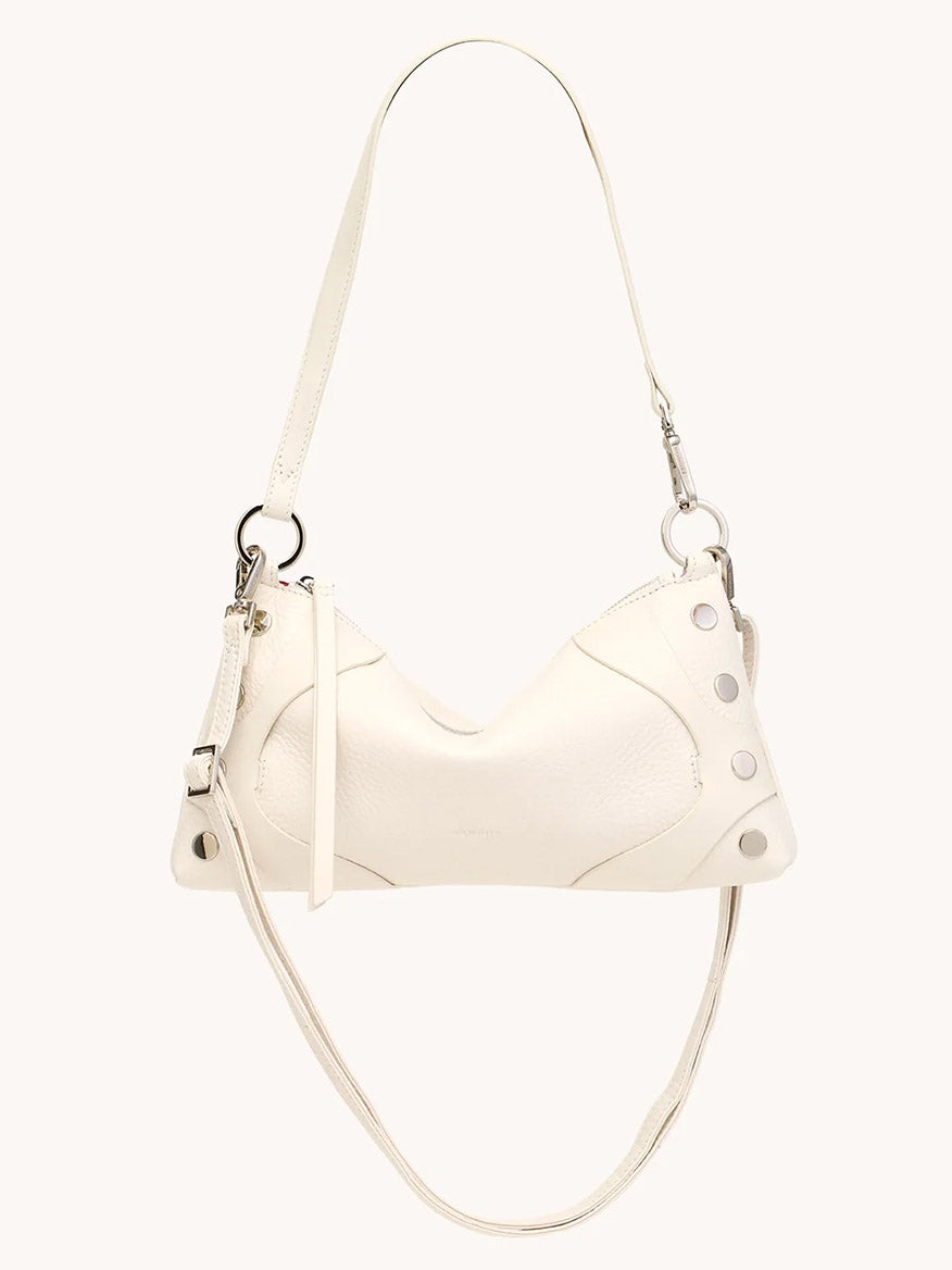 The Hammitt Los Angeles Kyle Shoulder Bag in Western Rein/Silver features white pebble leather, silver hardware, two straps—including an adjustable crossbody—and metal rivets on the corners, shown against a plain light background.