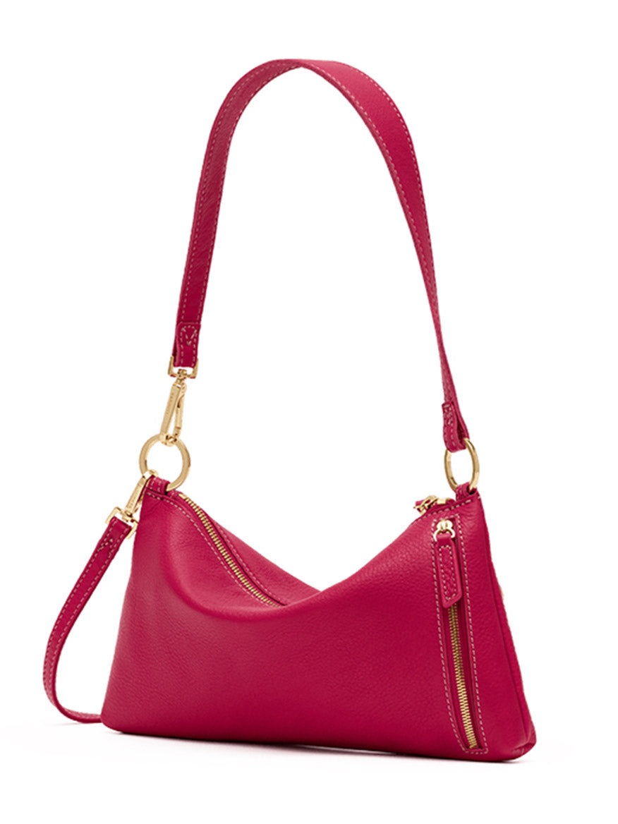 The Hammitt Los Angeles Kyle Shoulder Bag in Calypso Pebble/Gold is a small fuchsia pebbled leather handbag featuring gold hardware, a short handle, and two zippered compartments, shown against a white background.