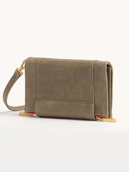 The Hammitt Los Angeles Levy Clutch in Pewter features taupe suede, a removable adjustable strap, and gold-toned metal accents at the corners.