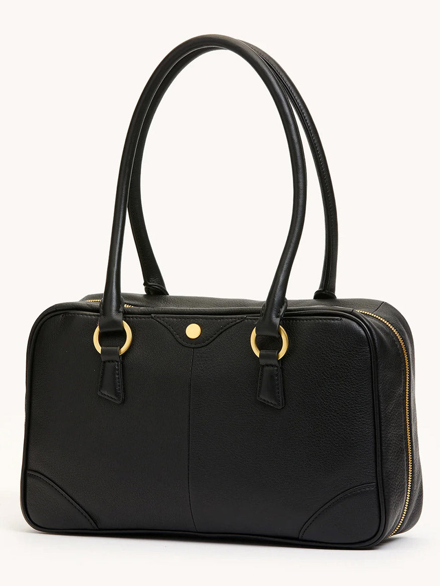 The Hammitt Los Angeles Meredith Medium in Black/Brushed Gold is a rectangular doctor-style bowling bag in black pebble leather, with two handles, gold hardware, and a zippered side opening, shown against a plain light background.