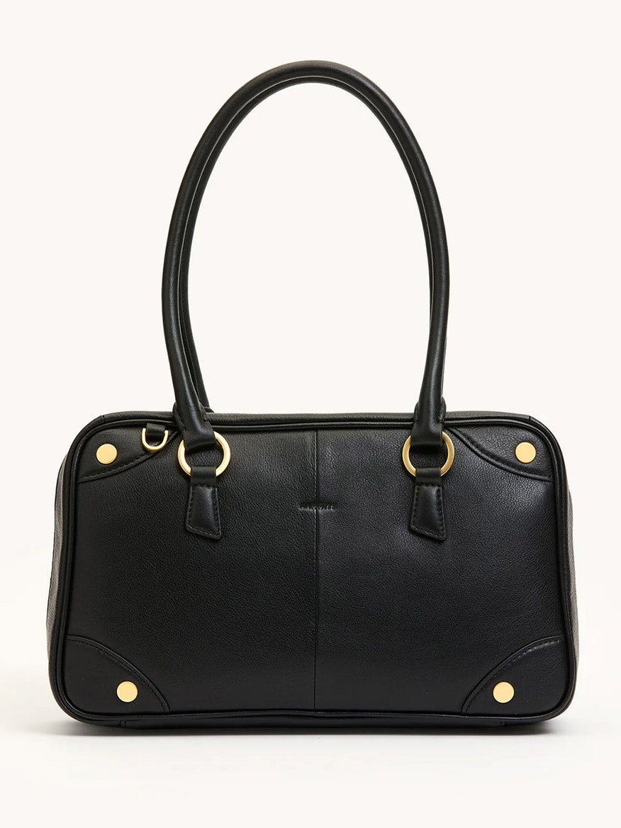 The Hammitt Los Angeles Meredith Medium in Black/Brushed Gold features black pebble leather, double handles, gold-tone corner accents, and a structured rectangular silhouette reminiscent of a doctor-style bowling bag.