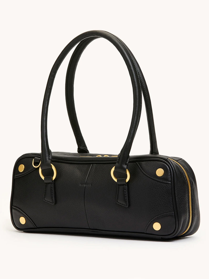 The Hammitt Los Angeles Meredith Small in Black/Brushed Gold is a black pebble leather doctor-style bowling bag featuring gold hardware, dual handles, rounded edges, and a zippered closure, displayed against a plain background.