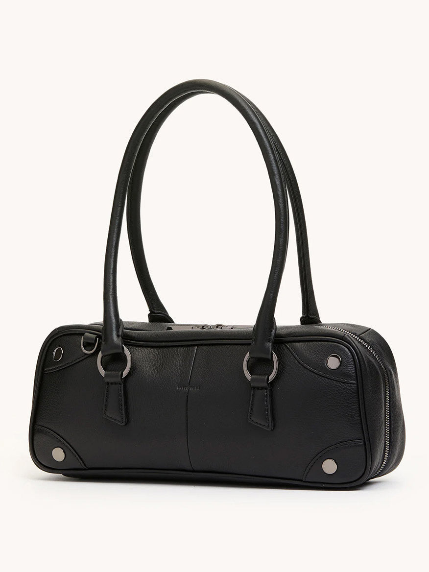 The Hammitt Los Angeles Meredith Small in Black/Gunmetal is a structured cylindrical crossbody handbag in black pebble leather with two handles and gunmetal ring and rivet details, shown against a neutral background.