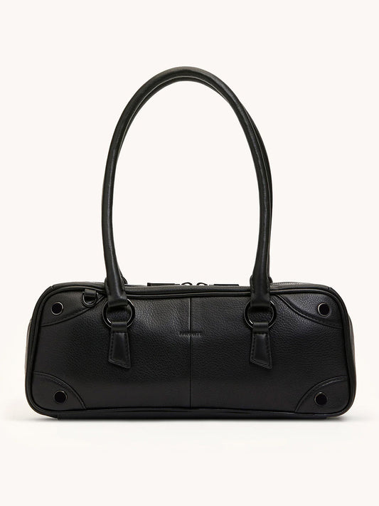 The Hammitt Los Angeles Meredith Small in Black/Gunmetal is a doctor-style pebble leather bowling bag with two long handles and minimal hardware, shown against a plain light background.