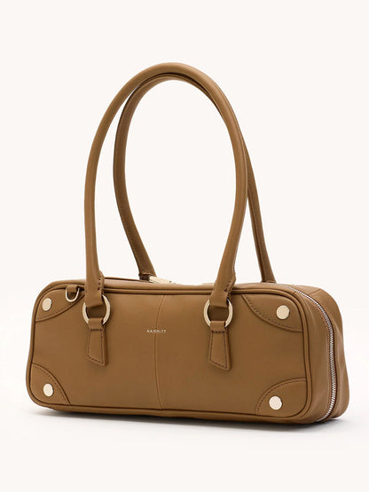 The Hammitt Los Angeles Meredith Small in Dune/Silver is a rectangular tan leather bowling bag with double handles, silver hardware, and visible stitching, displayed against a plain light background.
