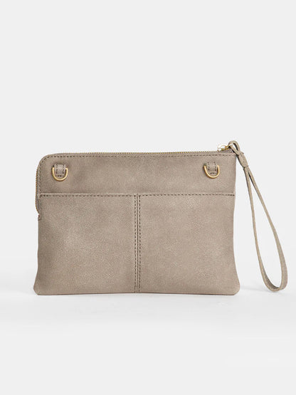 The Hammitt Los Angeles Nash Small Clutch in Pewter features a wrist strap, zip closure, and two metal rings on the front, along with a convertible strap that allows for versatile styling options.