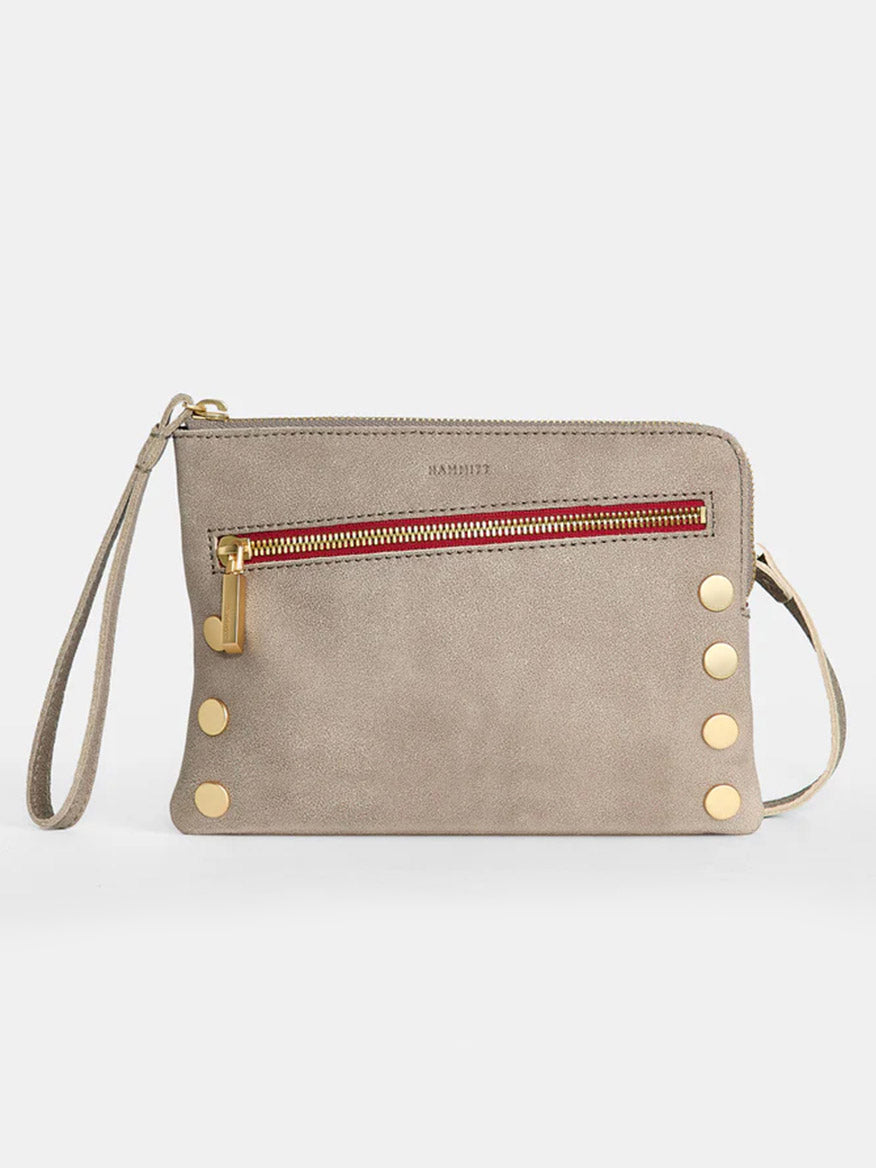 The Hammitt Los Angeles Nash Small Clutch in Pewter features a zippered front pocket, gold-tone button accents, and a wrist strap for carrying. It also includes a convertible strap for added versatility.