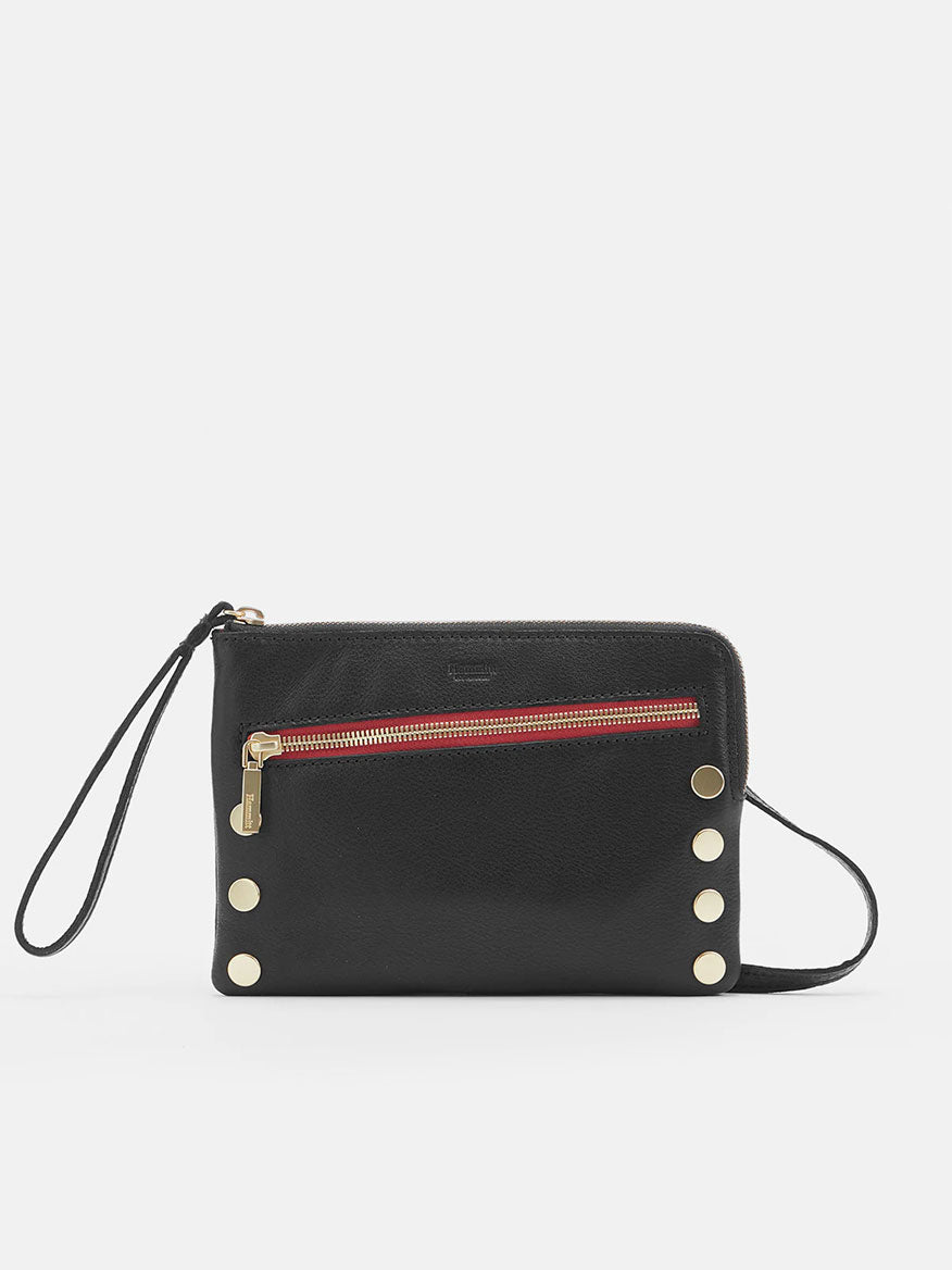 The Hammitt Los Angeles Nash Small Clutch in Black features a front zipper pocket, brushed gold hardware, and a removable crossbody strap, complete with a stylish red zip.