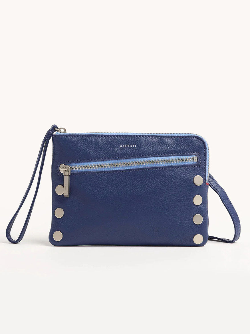 The Hammitt Los Angeles Nash Small Clutch in Jazz Blues is crafted from blue pebbled leather and features a zipper pocket, silver button accents, and a versatile wrist strap that converts into a crossbody.