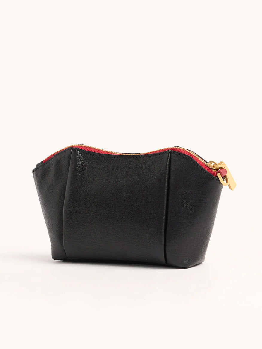 The Hammitt Los Angeles Paul Pocket in Black Press/Brushed Gold is a mini evening clutch crafted from luxurious Italian calf leather, featuring a gold zipper and red lining, shown against a plain light background.