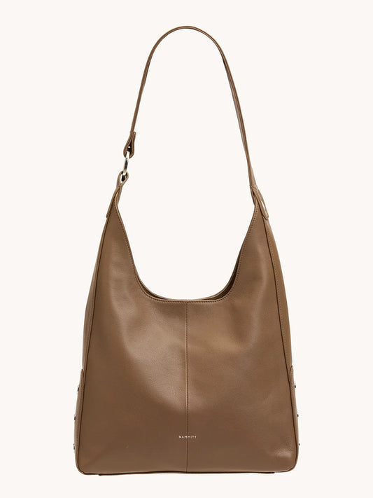 The Hammitt Los Angeles Tim Med Hobo in Dune/Silver is a brown leather hobo bag with a curved top handle and minimal detailing, displayed against a plain light background.