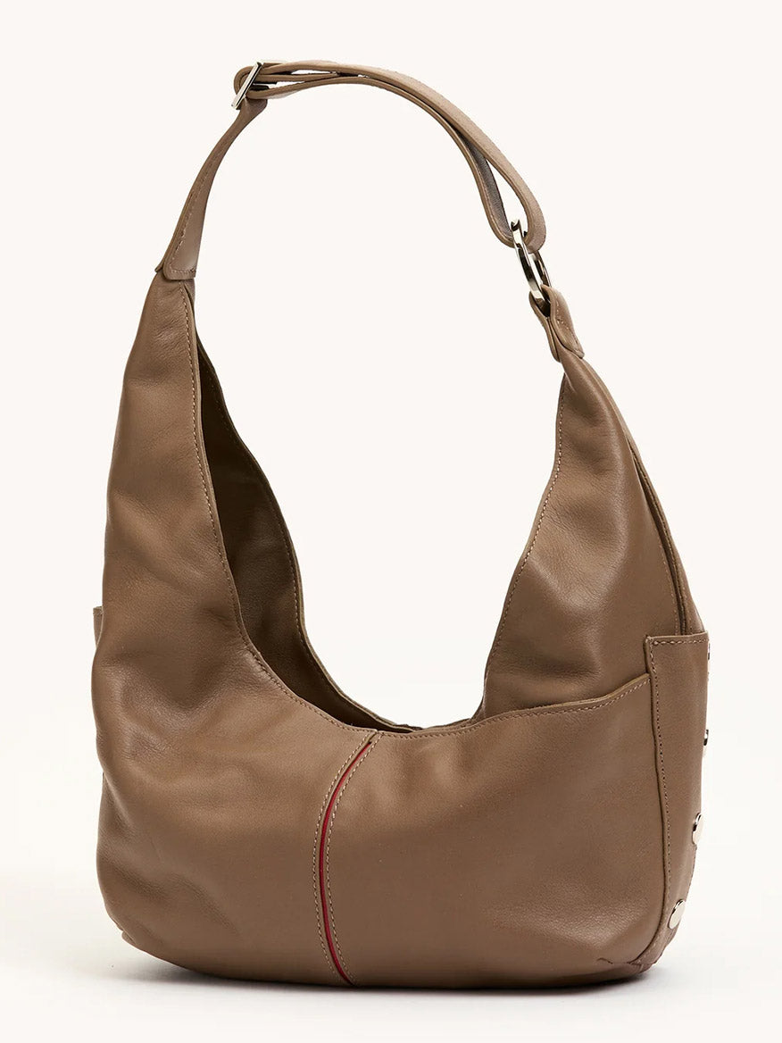 The Hammitt Los Angeles Tom Zip Medium in Dune/Silver is a taupe hobo bag with an adjustable shoulder strap, visible seam detail, zippered main compartment, and subtle metal studs on the side.