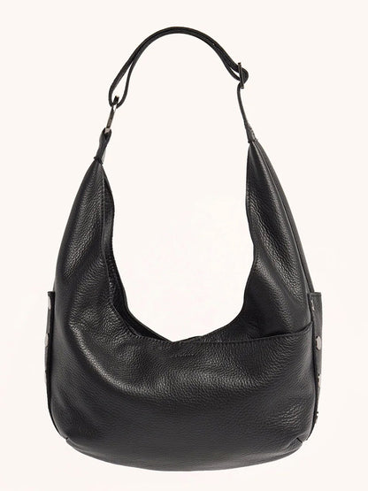 The Hammitt Los Angeles Tom Zip Medium in Black/Gunmetal is a black pebbled leather hobo bag with an adjustable shoulder strap and gunmetal rivet details, shown against a plain light background.